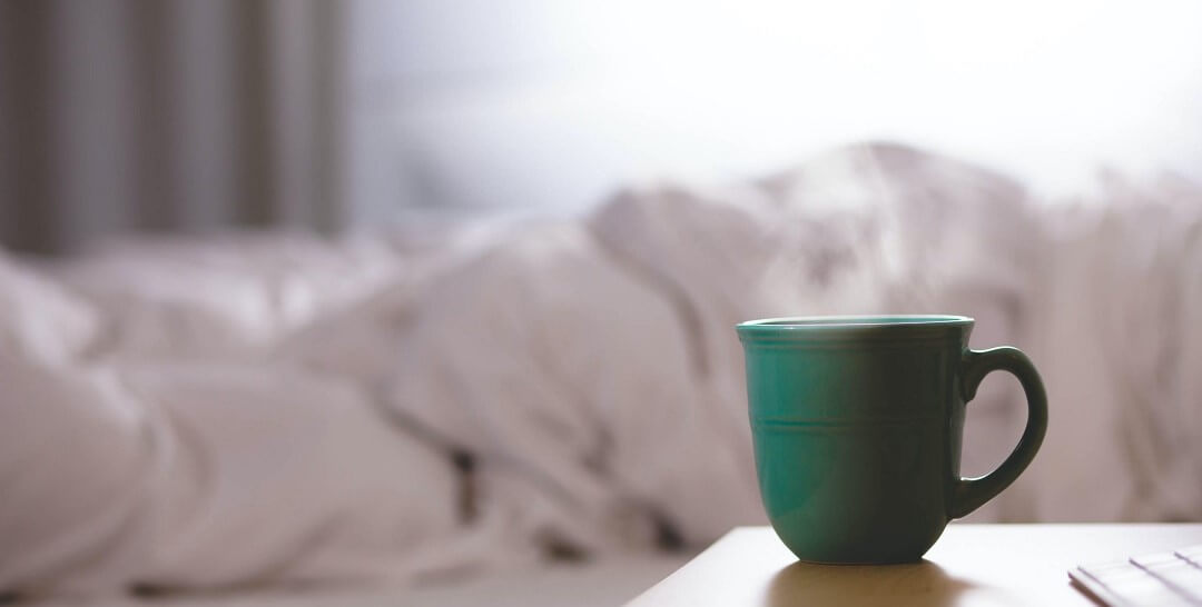 Coffee on bedside table