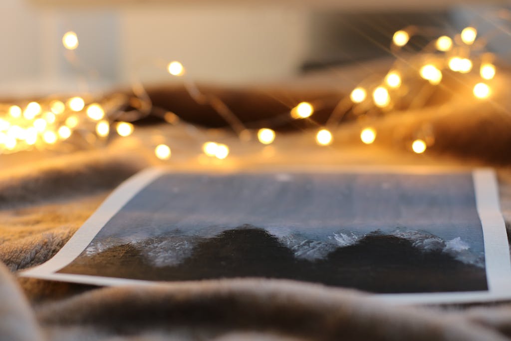 Warm string lights illuminating a photo print creating a cozy indoor ambiance. Perfect when you want to have better weekends in the middle of winter